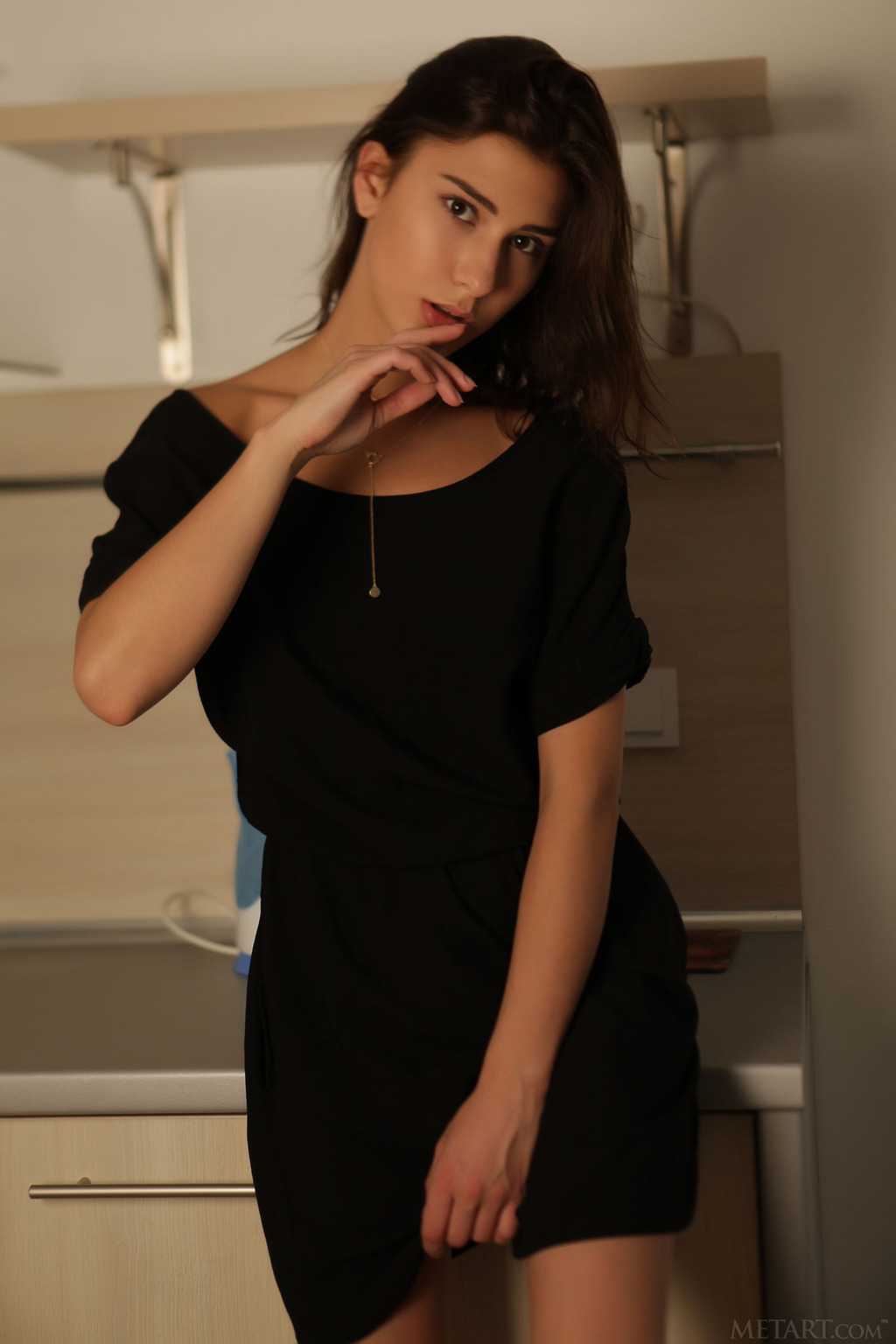 gorgeous brunette in a sexy black dress 01