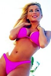 Busty blonde on the beach